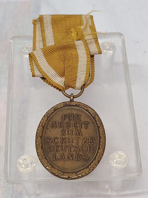 Antique German Medal with a yellow ribbon