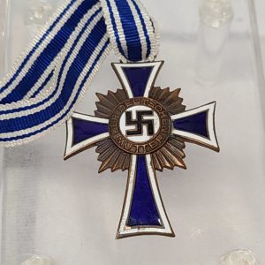 Antique German Medal from December 16, 1938, Nazi symbol in front of a navy blue cross